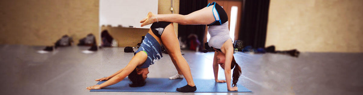 Students stretching in pairs